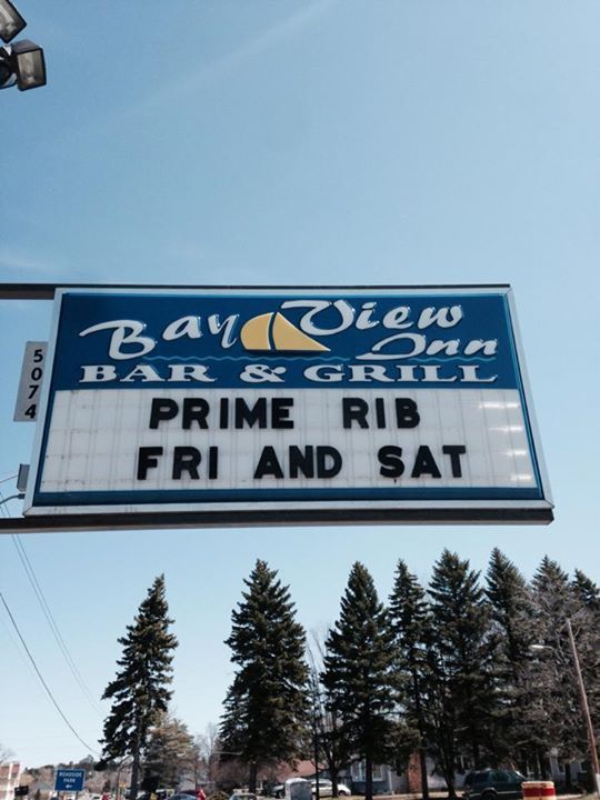 A sign for the bay view inn advertising prime rib friday and saturday