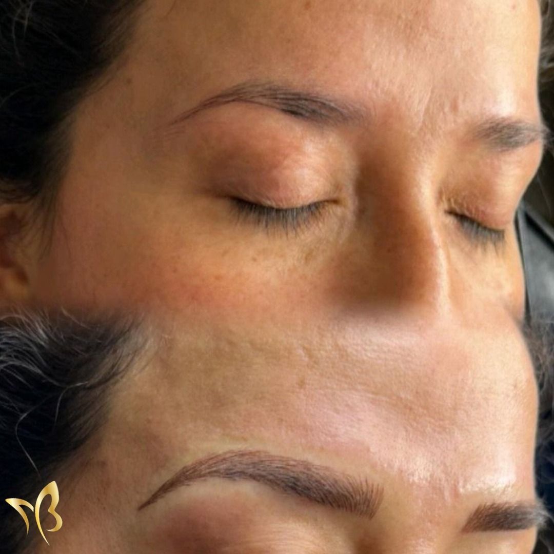 A close up of a woman 's face with her eyes closed.