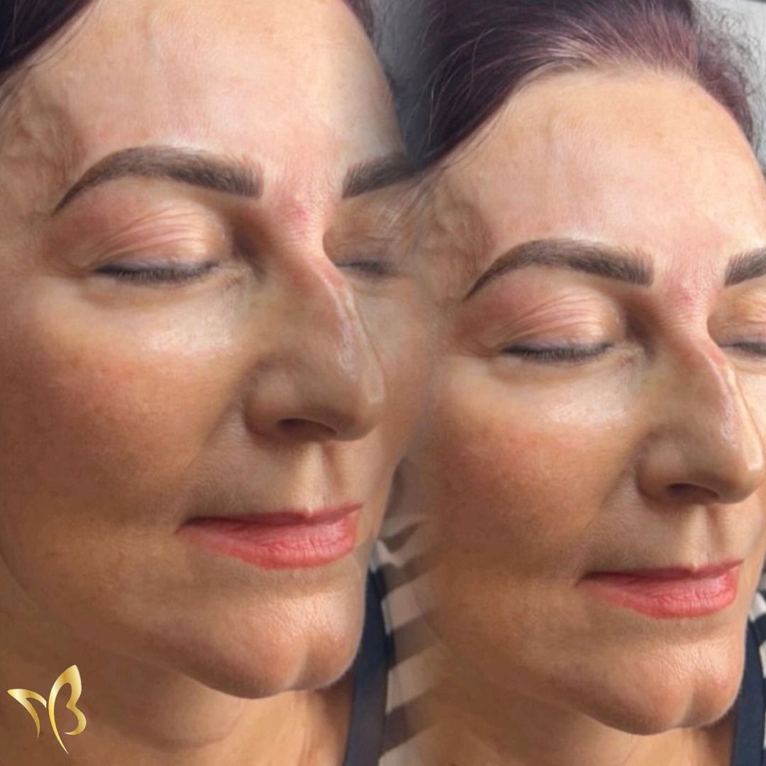 A close up of a woman 's face with her eyes closed