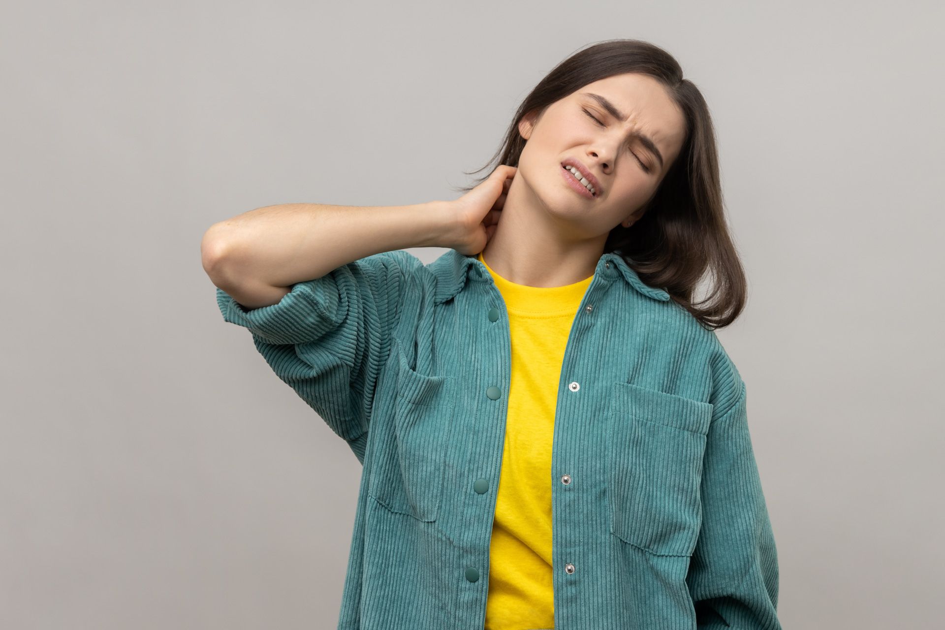 Woman having a neck pain