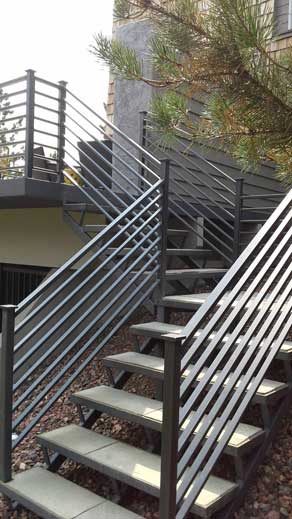 A Woman By Iron Stair Rails — Indoor Stair Railings in Billings, MT