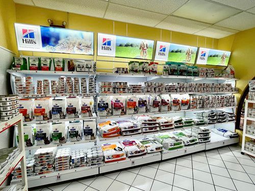 A store filled with lots of different types of dog food.