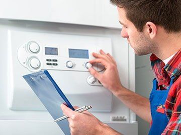 Plumber Checking the Water Heater — Emergency Plumbing in Cocoa, FL