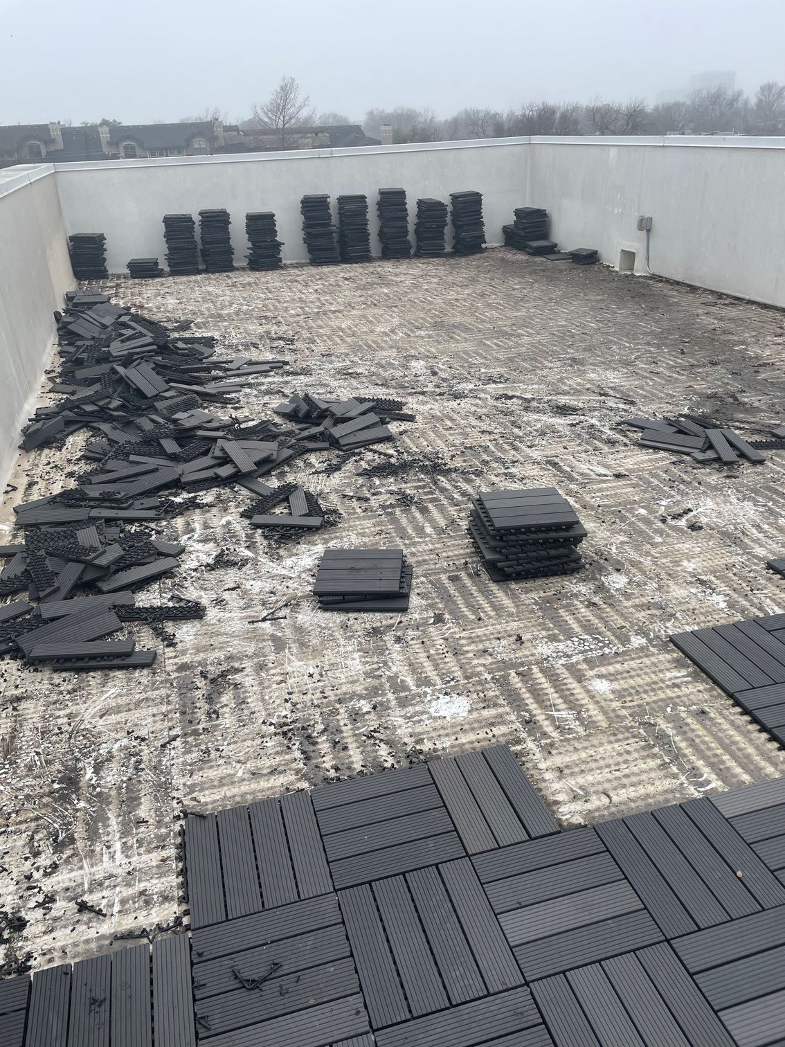 A roof with a lot of black tiles on it.