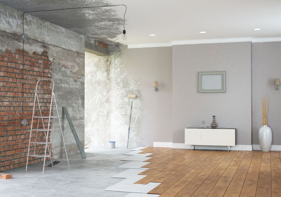 A before and after picture of a living room being remodeled.