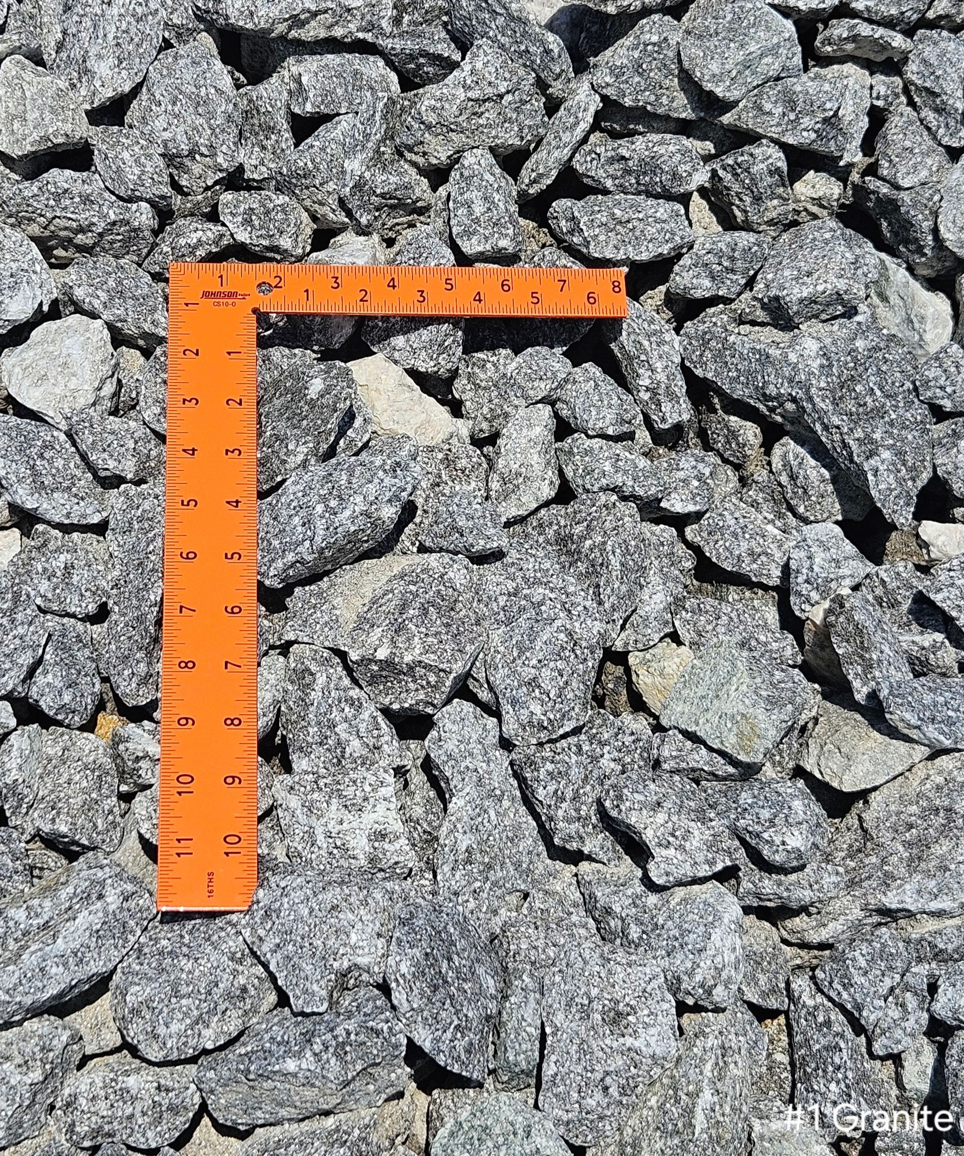 A pile of gravel is sitting on the ground.
