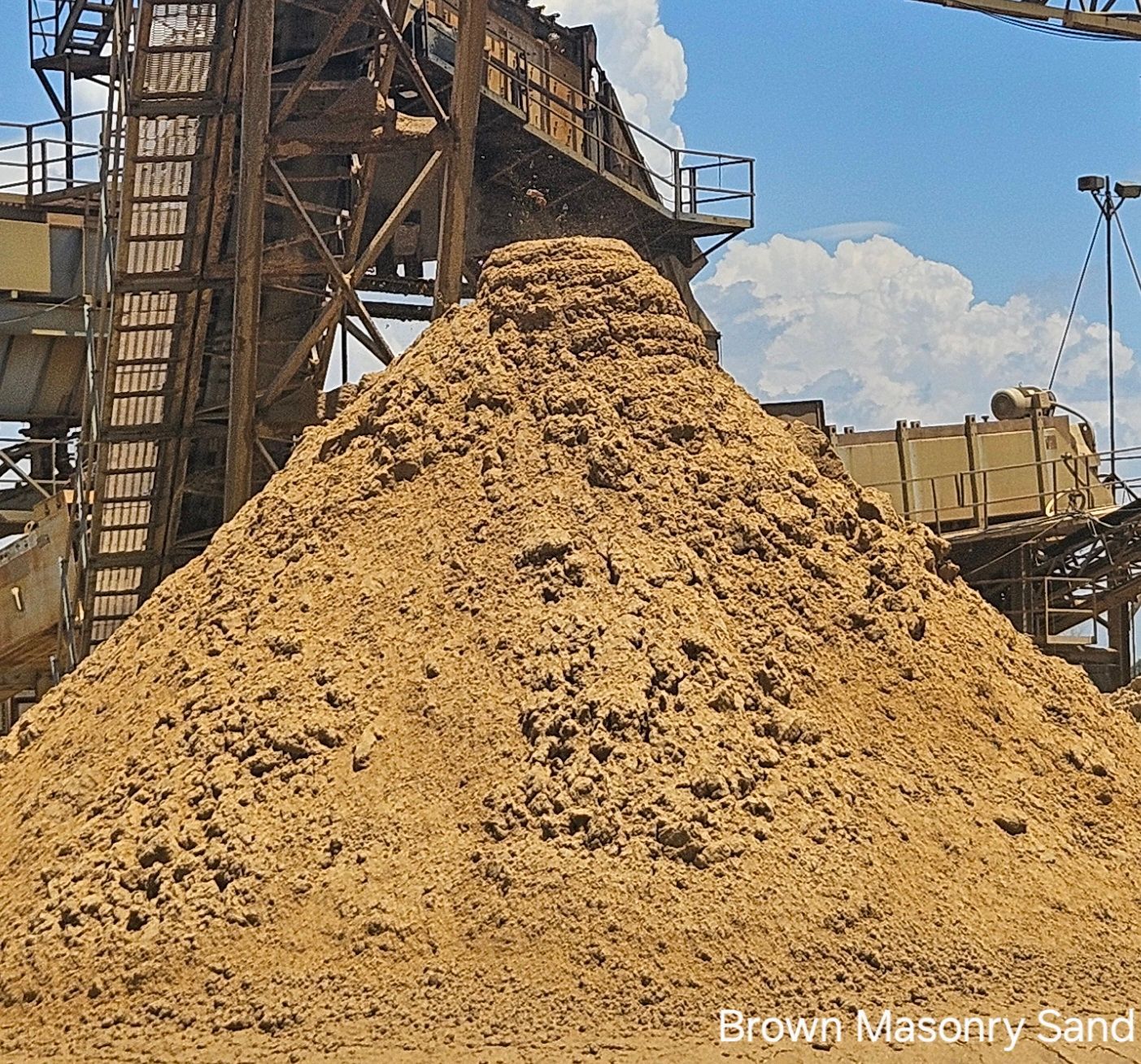 A pile of gravel is sitting on the ground.