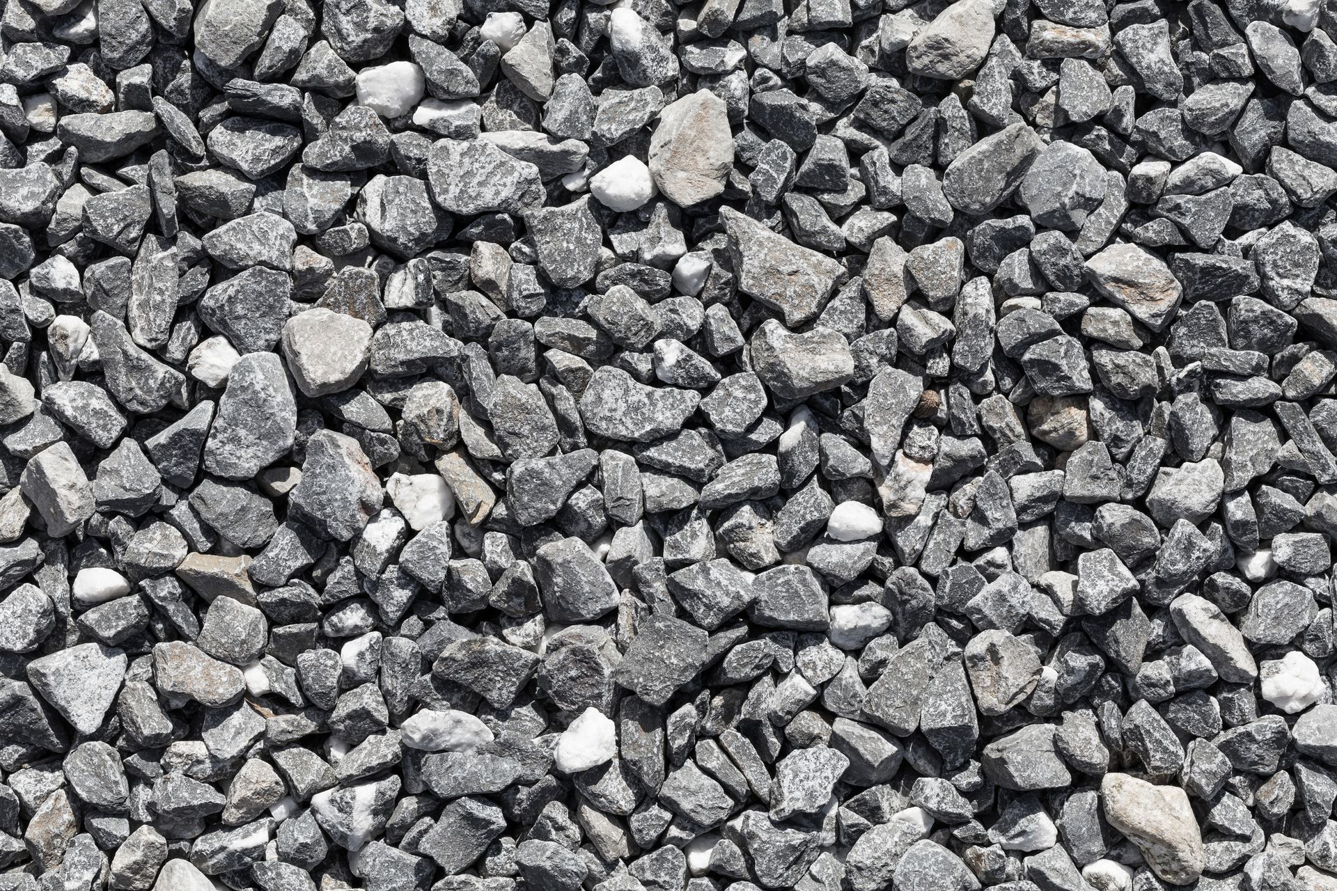 A pile of gravel is sitting on the ground.