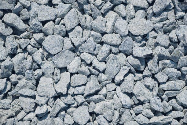 Close-up of crushed stones and rocks texture, perfect for construction stone supplier visuals