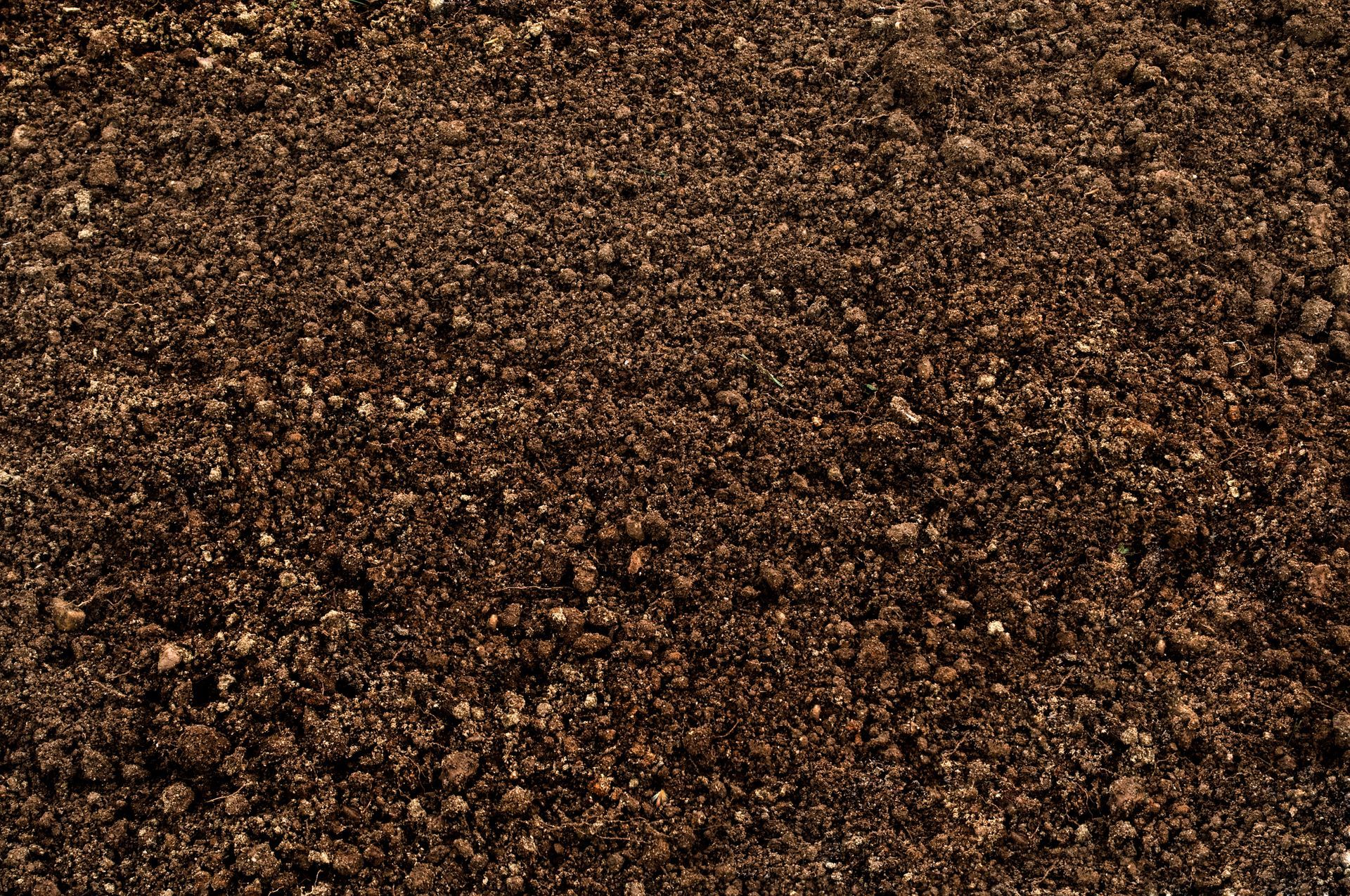 A close up of a pile of brown gravel.