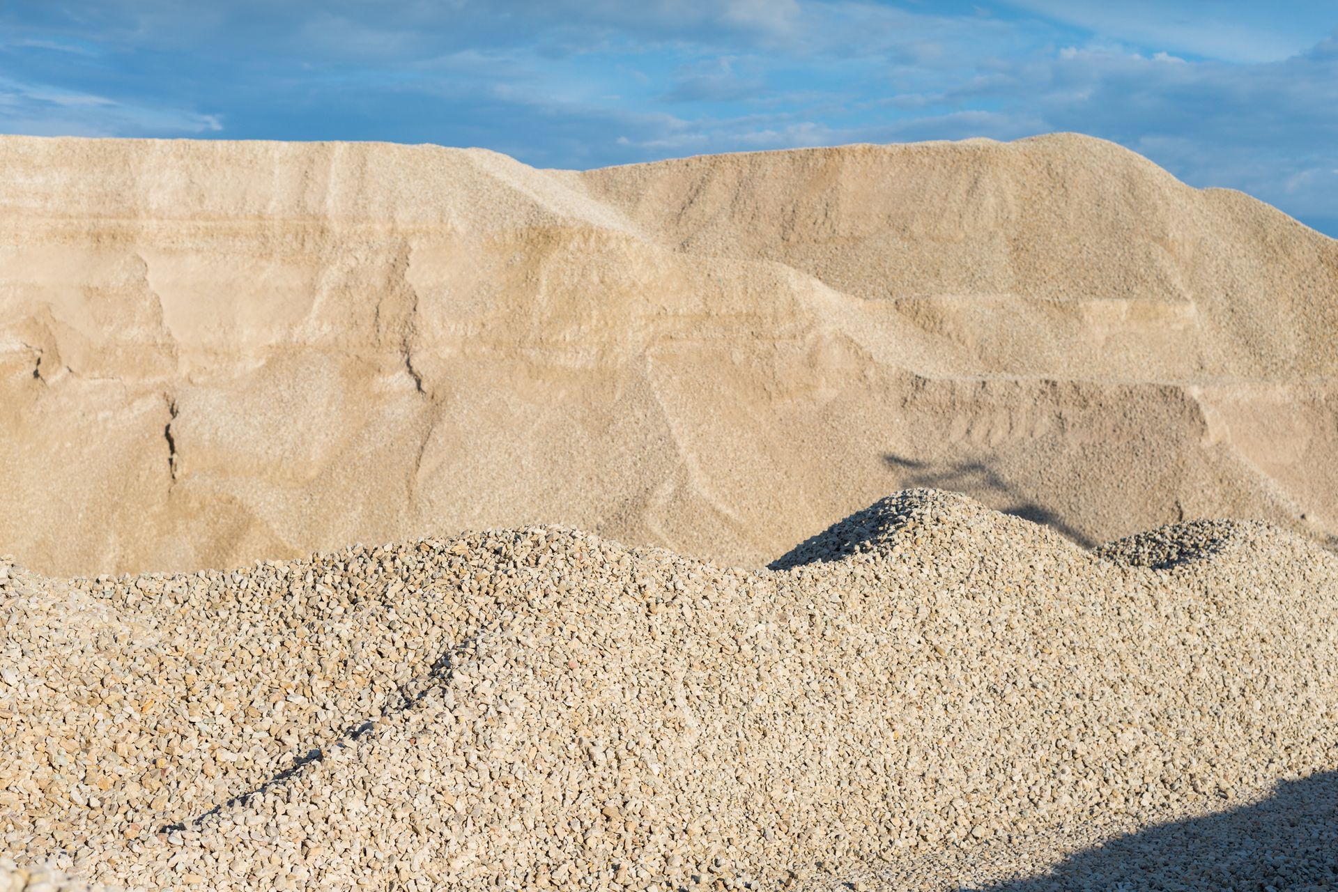 A pile of gravel is sitting on top of a hill.