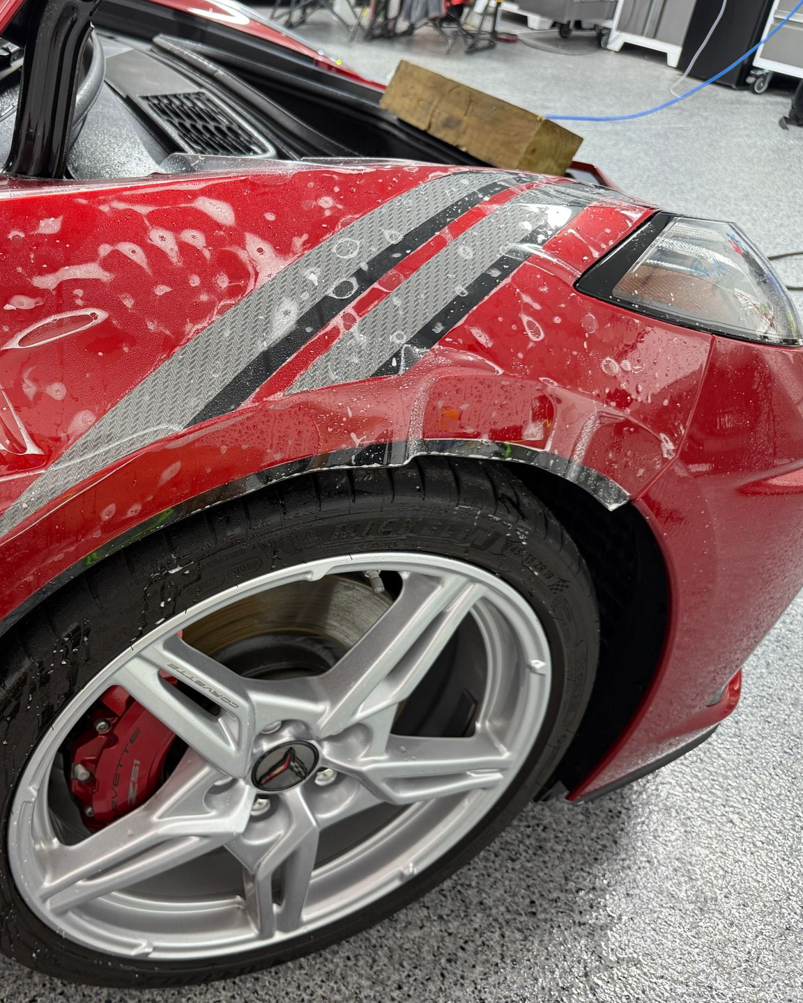 A close up of a car wheel with a mercedes logo on it