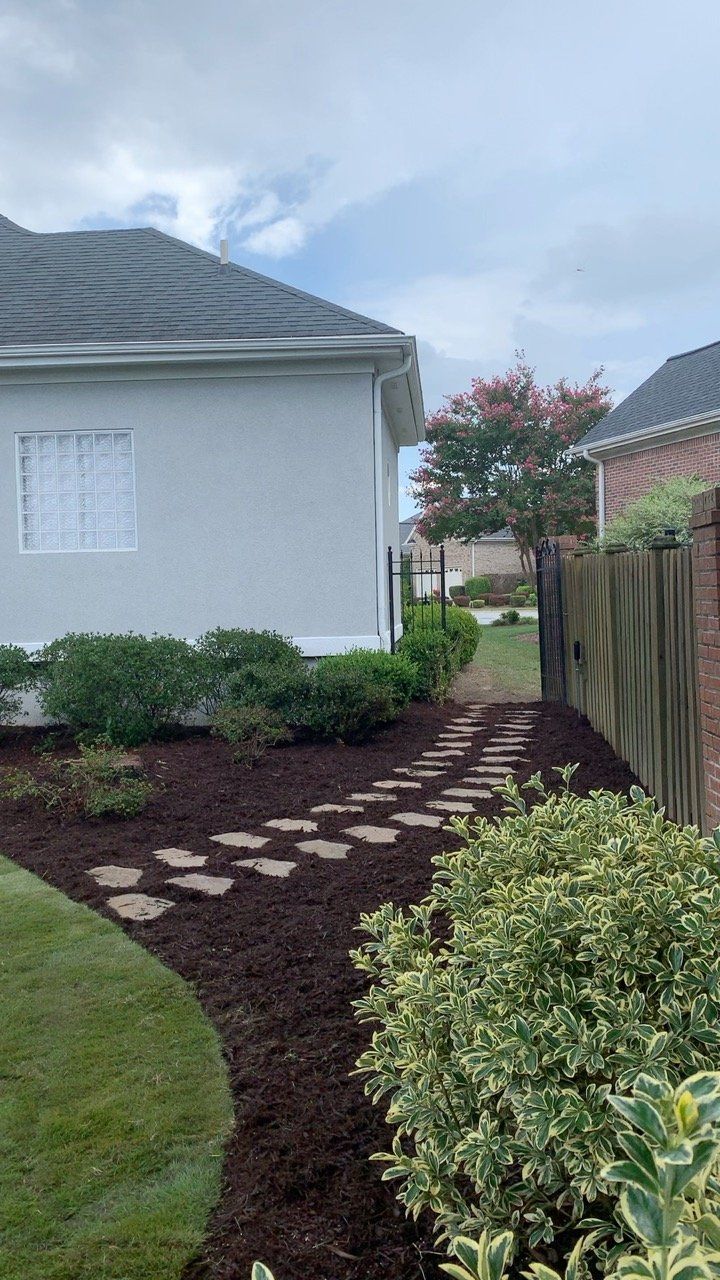 Natural Brick Pavers Creating Path Through Garden