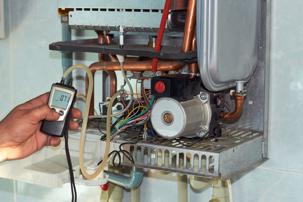 A Water Heater With a Fan Attached to It — Ryno's Plumbing Group in Lakewood, NSW