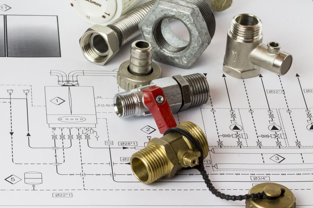 A Bunch of Plumbing Parts on Top of a Drawing — Ryno's Plumbing Group in Lakewood, NSW