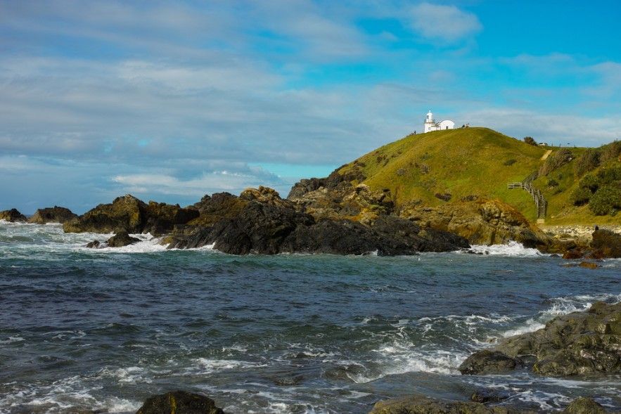 A Lighthouse on Top of a Hill Overlooking a Body of Water — Ryno's Plumbing Group in Port Macquarie, NSW