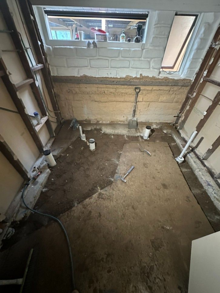 A Room With a Lot of Pipes and a Window — Ryno's Plumbing Group in Lakewood, NSW