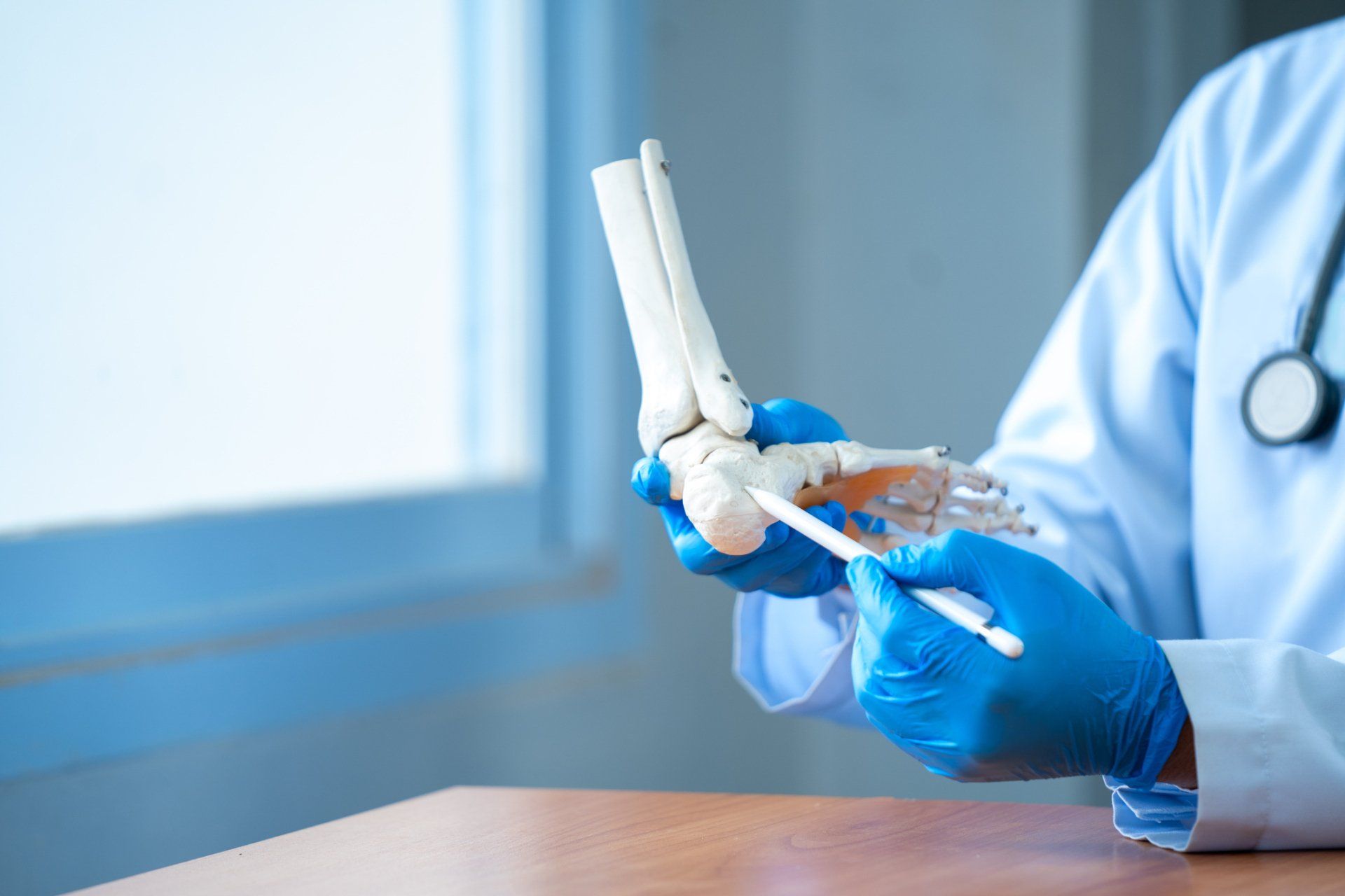 Doctor Checking a Patient's Foot — Joliet, IL — Caneva Foot & Ankle Clinic