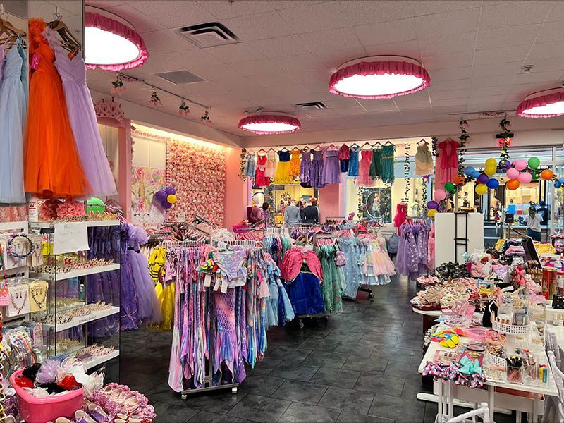 A store filled with lots of clothes and balloons.