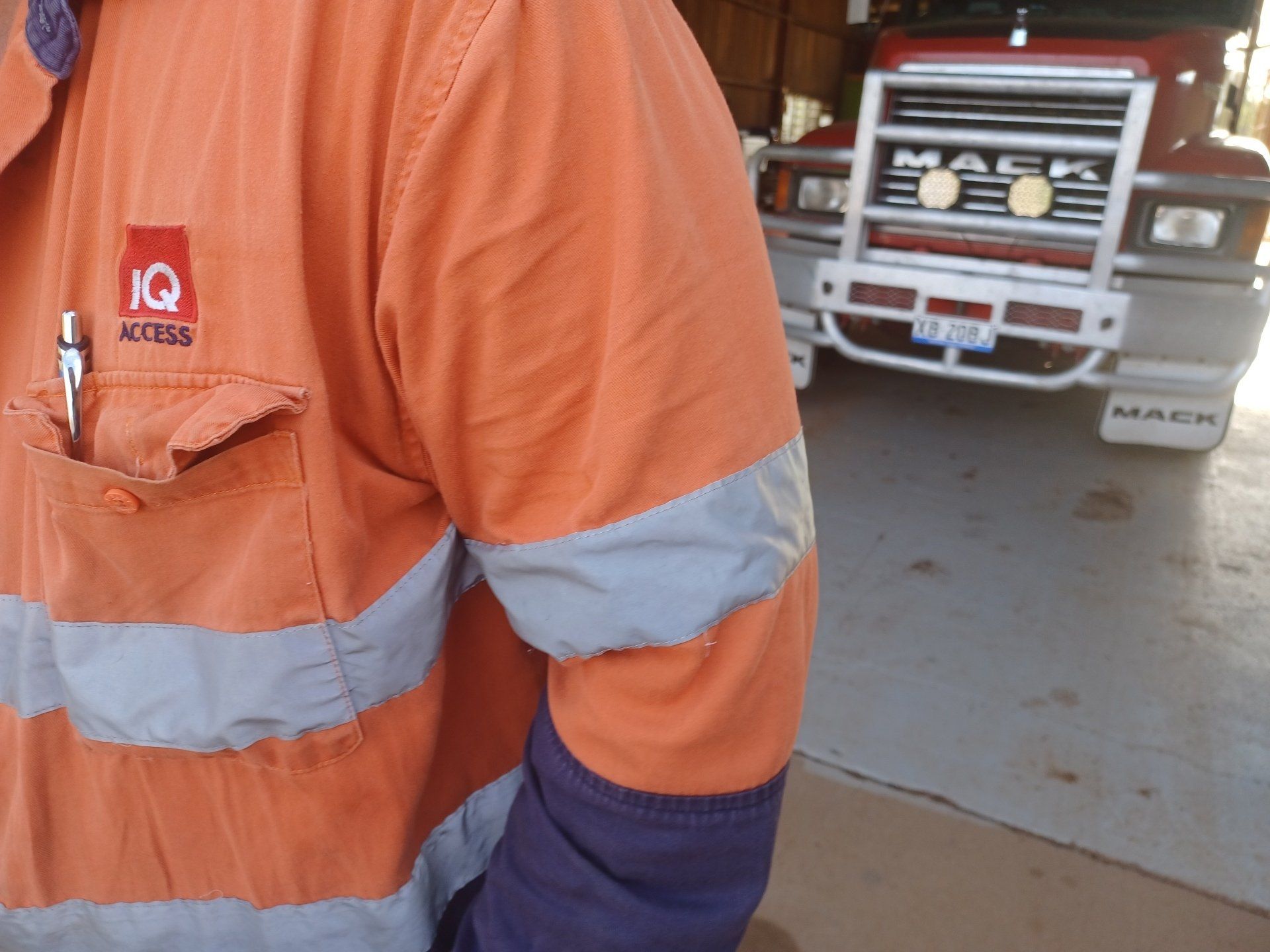 A Worker Standing in front of Truck  — Labour And Equipment Hire in Mount Isa, QLD