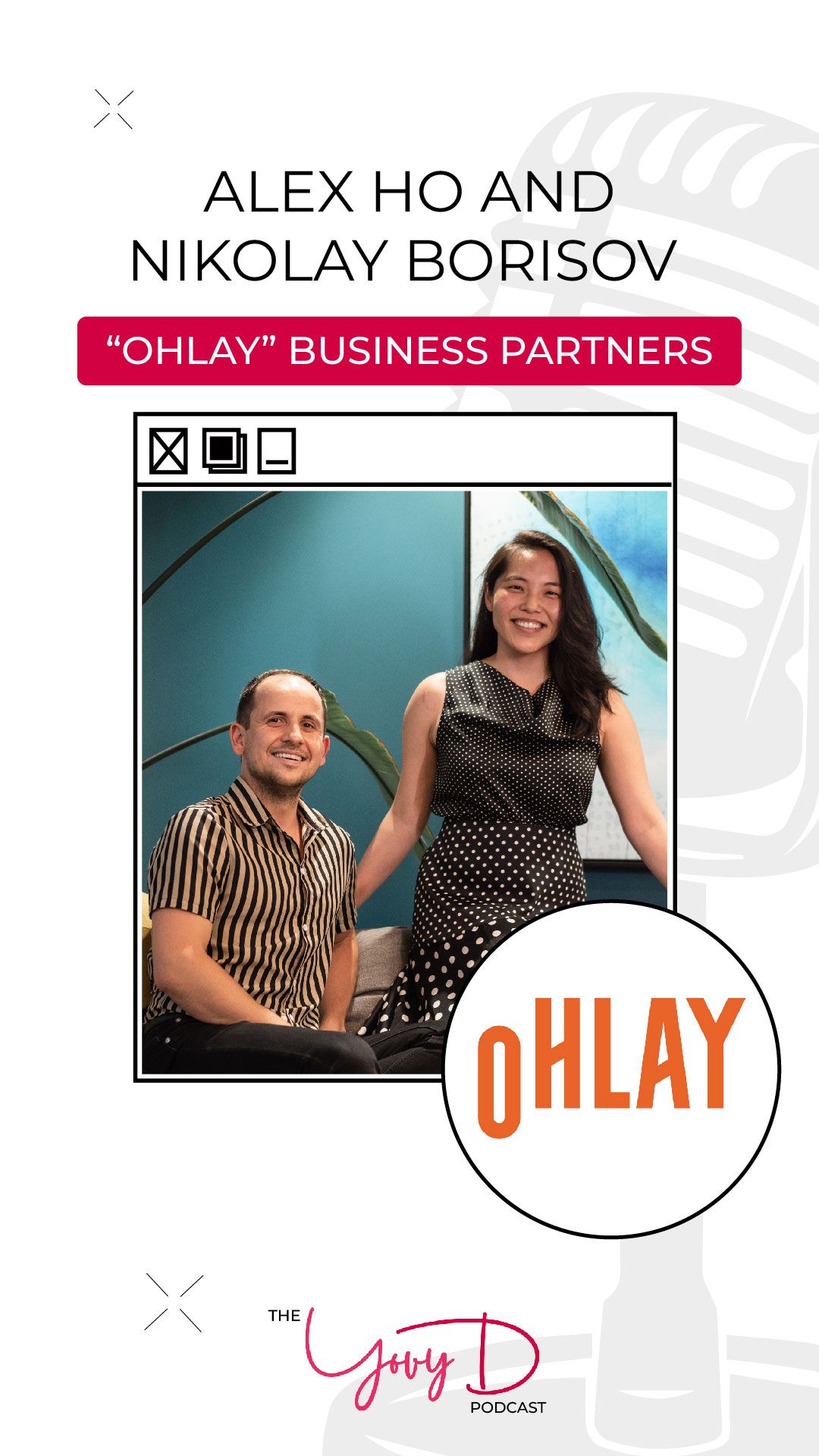 A man and a woman are sitting next to each other in front of a microphone.