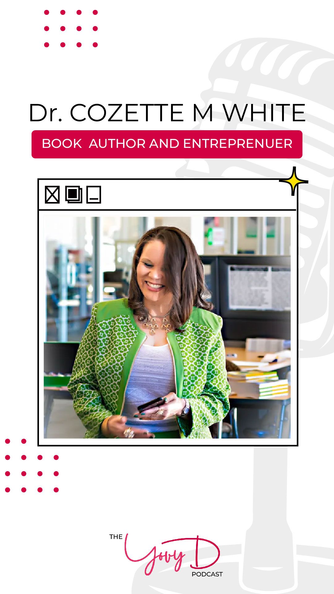 A woman in a green jacket is standing in front of a microphone.