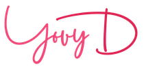 A close up of a pink signature on a white background.
