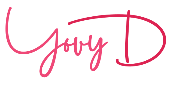 A close up of a pink signature on a white background.