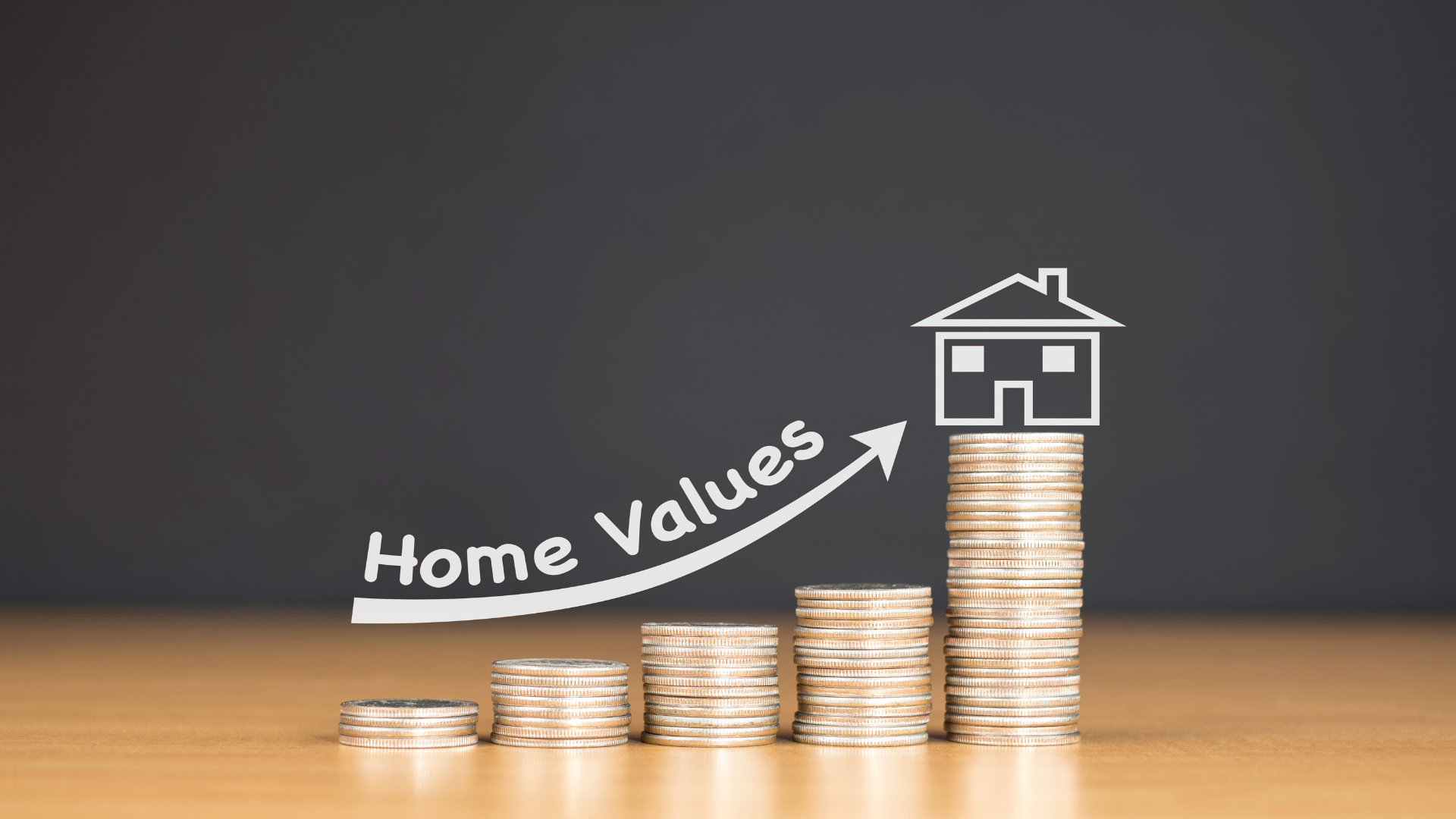 Stacks of coins with a house on top and an arrow, indicating rising home values.