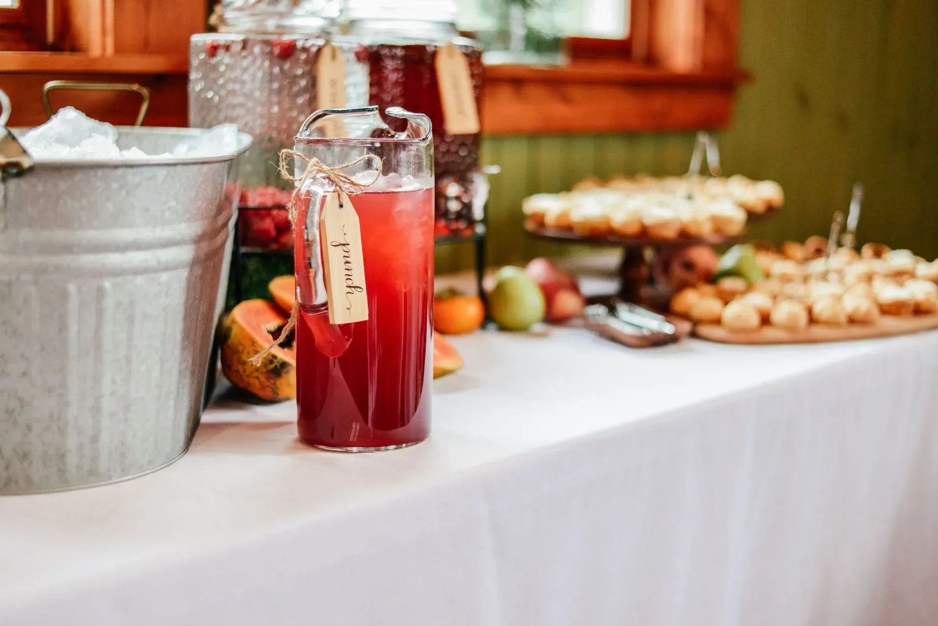 punch-water-sweet-tea-station-with-metal-ice-buckets-and-desserts.