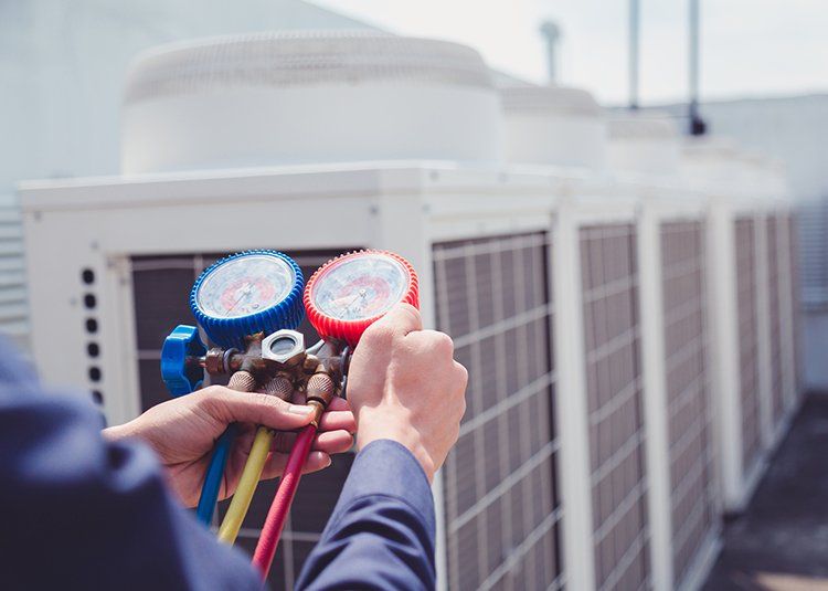 Checking the Air Conditioner — Fort Myers, FL — Florida Contracting And Cooling