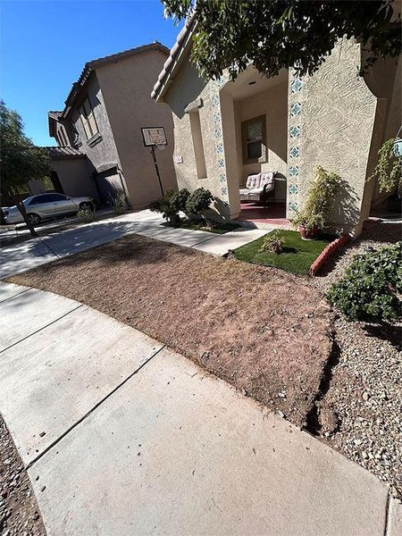 A house with a basketball hoop in front of it