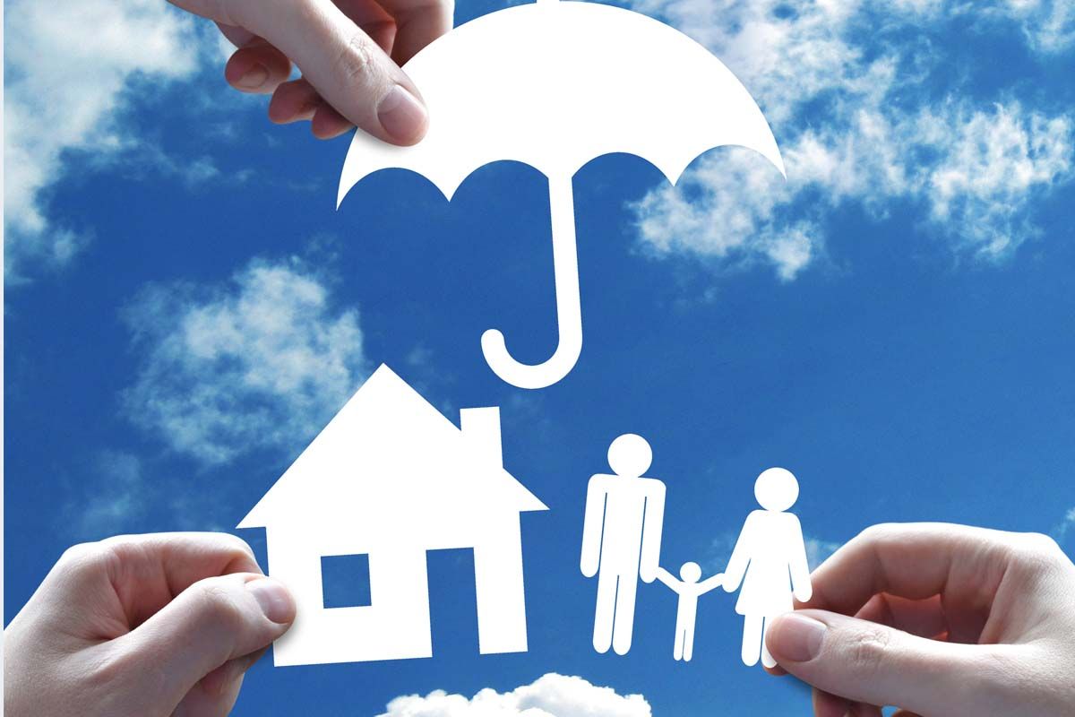 An umbrella over a house and family