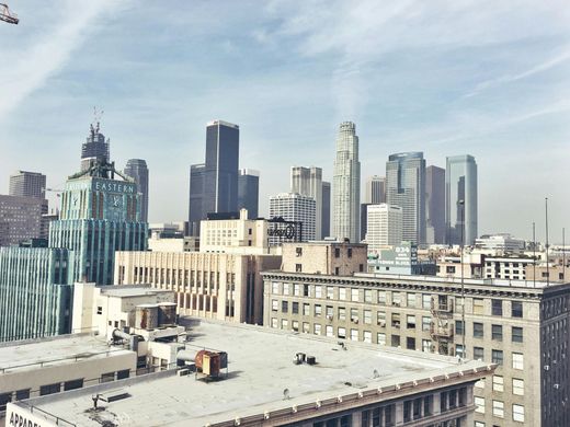An aerial view of a city skyline with a lot of buildings