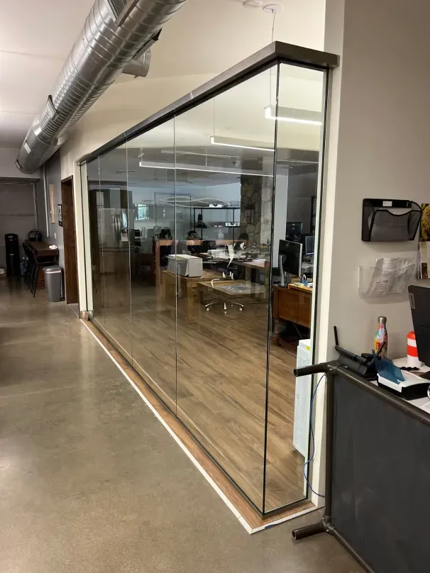 There is a large glass wall in the middle of the room.