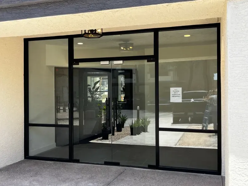 A building with a lot of glass doors and windows