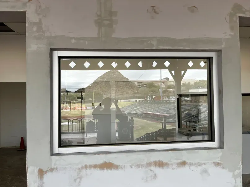 A window with a view of a pyramid in the background