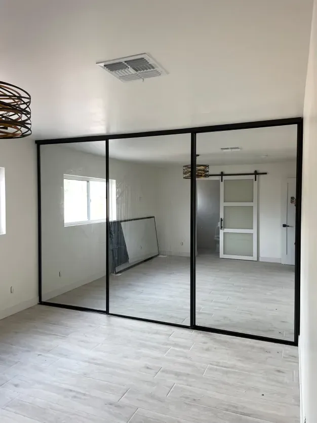 There is a large mirror in the middle of the room.