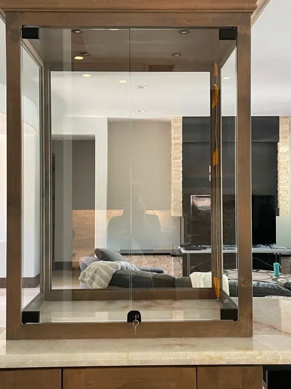 There is a mirror in the middle of the room that looks like a cube.
