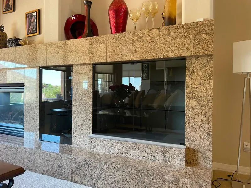 A living room with a fireplace and a lamp