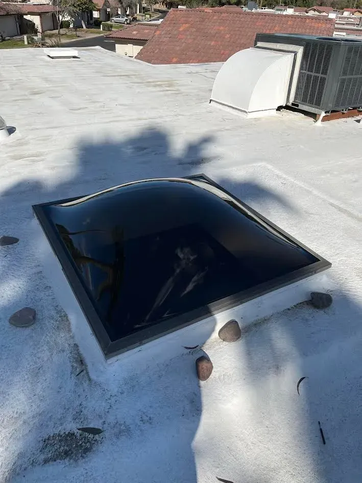 There is a skylight on the roof of a building.