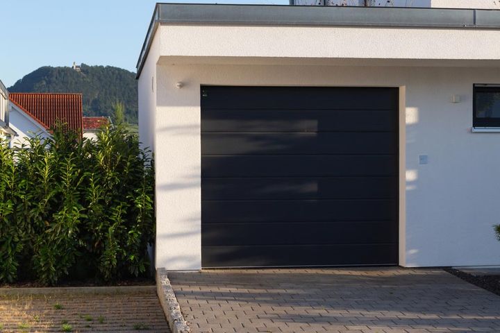 Home With  Black Garage — Garages & Sheds in Coffs Harbour, NSW