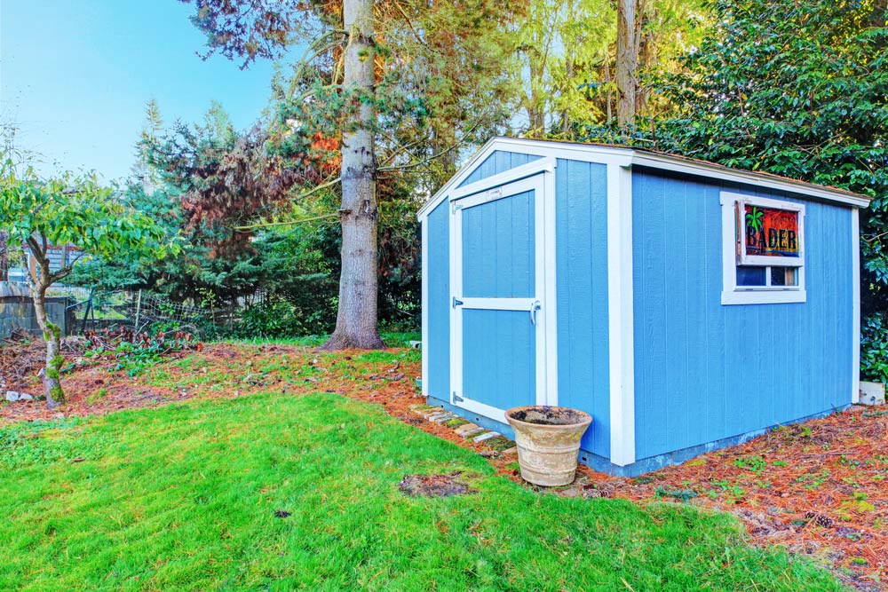 Small Blue Backyard Shed — Garages & Sheds in Nambucca Heads, NSW