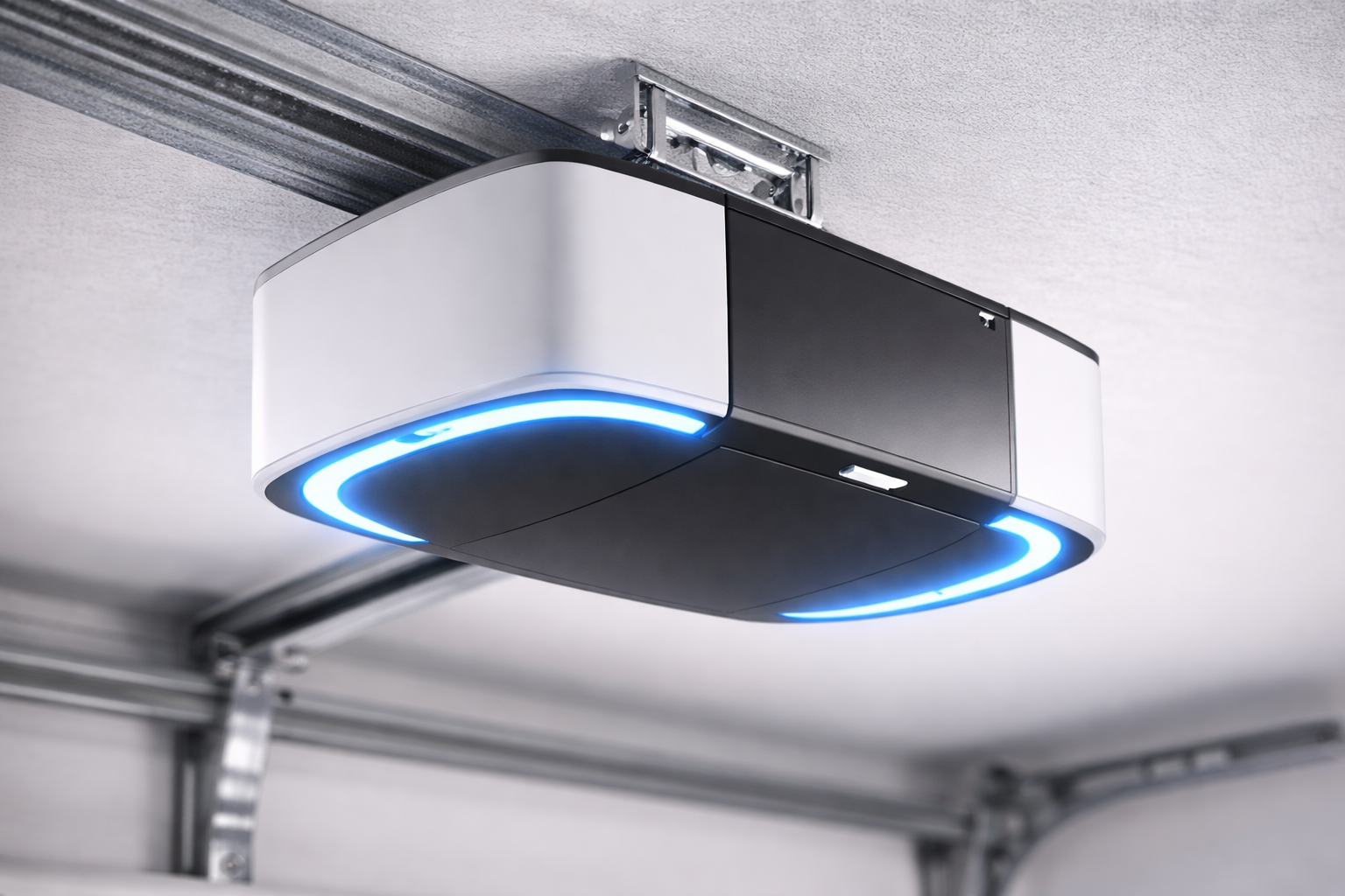 Garage door opener with a black and white body and a blue light ring. Installed on a garage ceiling.