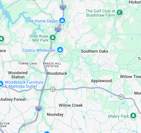 Map of the Woodstock, Marietta, and Kennesaw area with roads, neighborhoods, and parks labeled.
