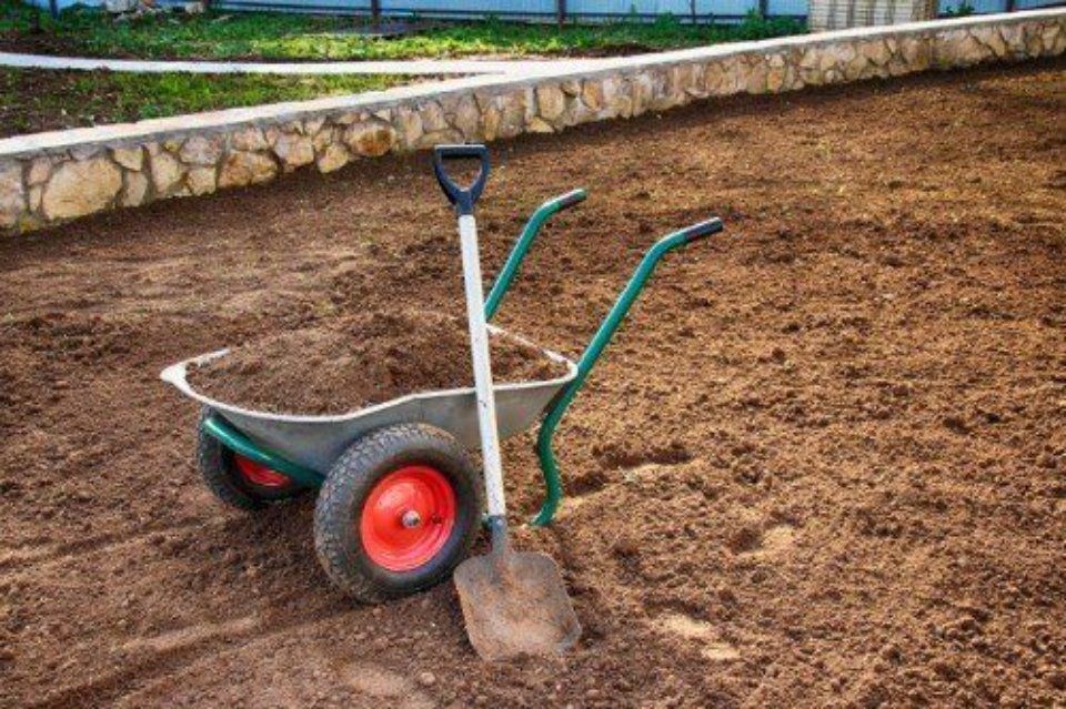 Wheelbarrow with soil