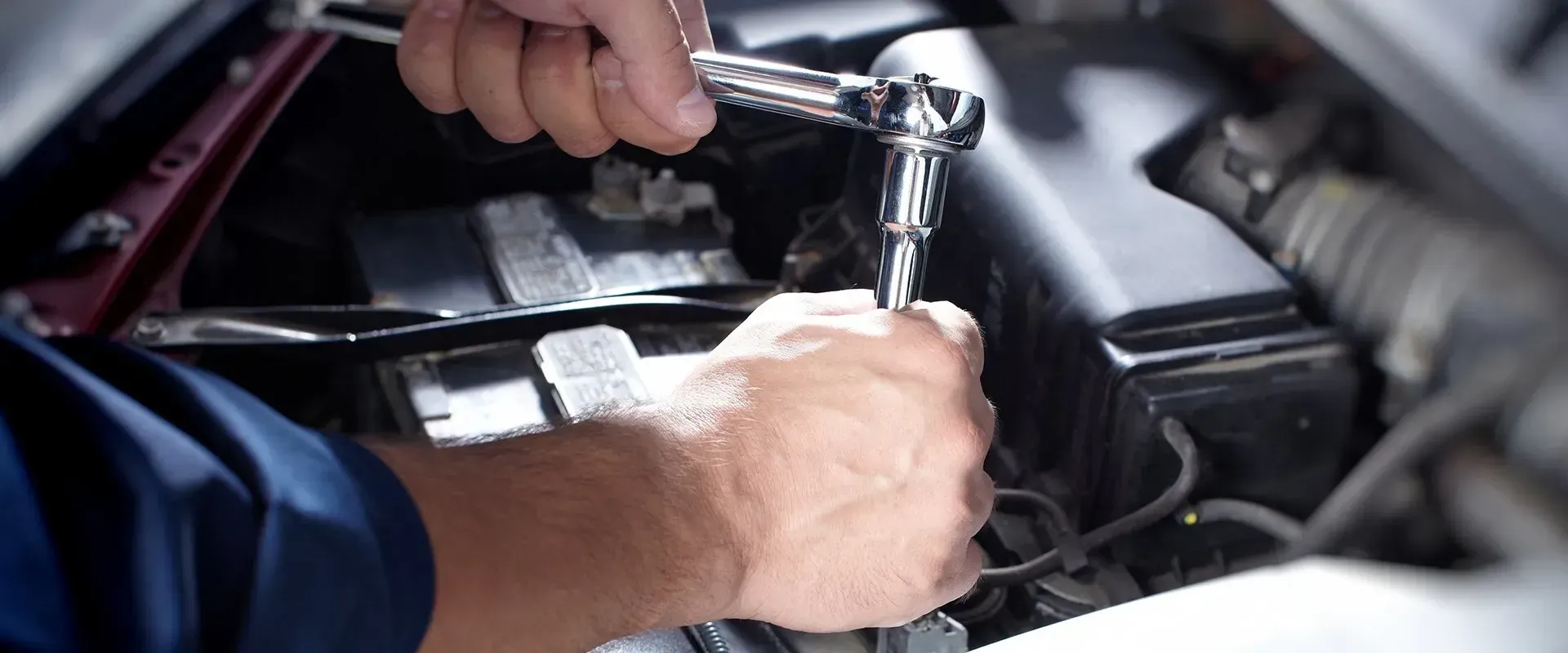 Mechanic Working on A Car Engine, Hands on An Intake Manifold — Wallsend Automotive in Maryland, NSW