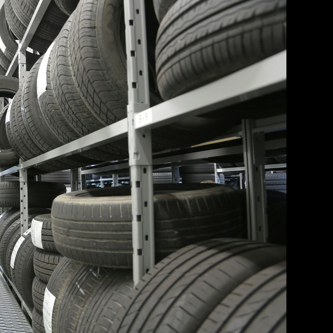 A bunch of tires are stacked on top of each other