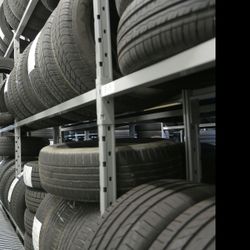 A bunch of tires are stacked on top of each other