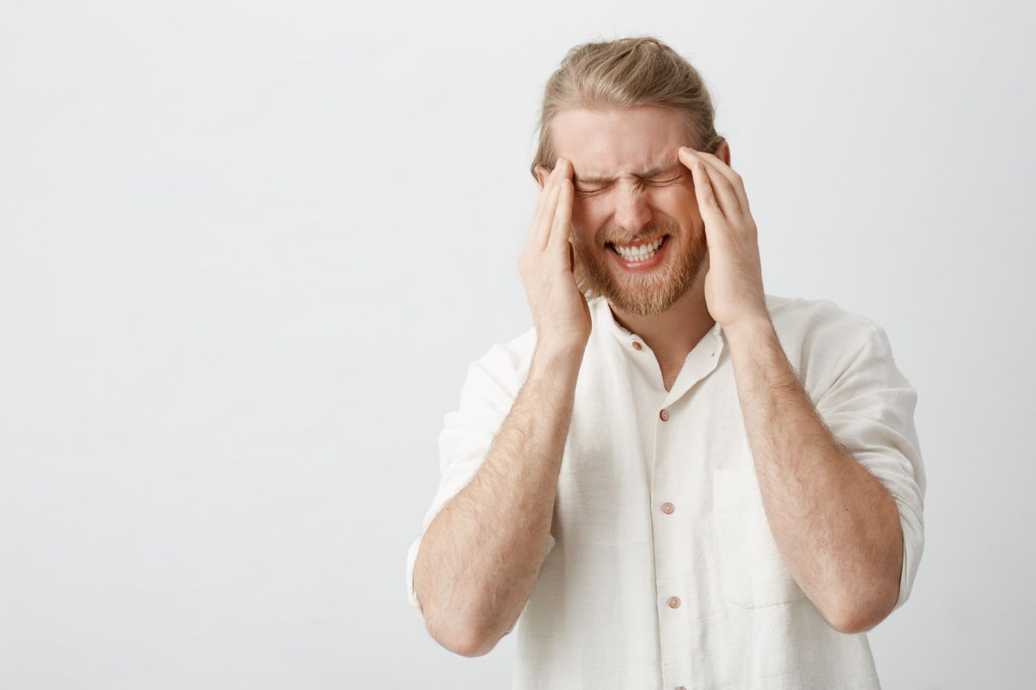 man suffering from headache